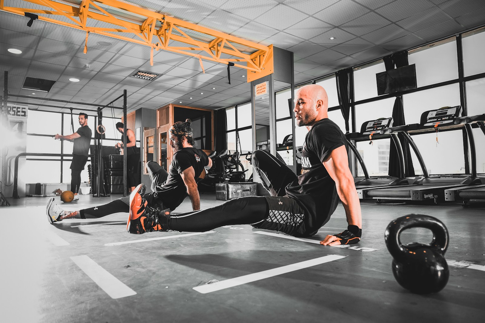Woman in activewear exercising in a studio. The kind of guest experience ReFiles helps digitize with branded forms and e-sign